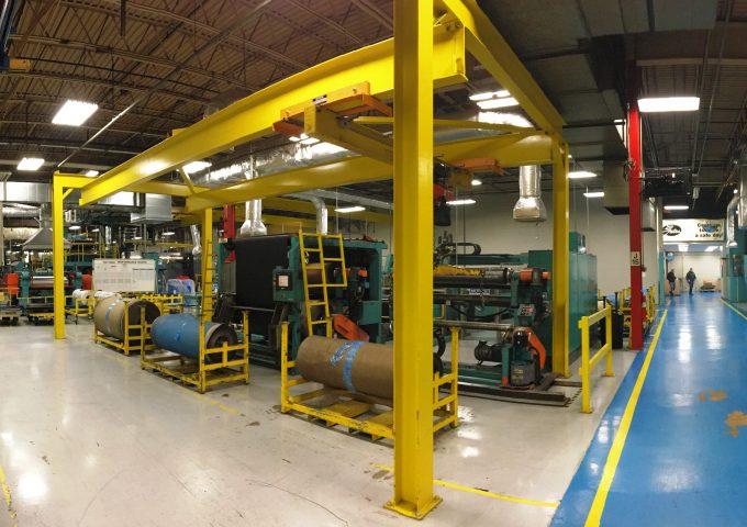 Large industrial room with crane support system.