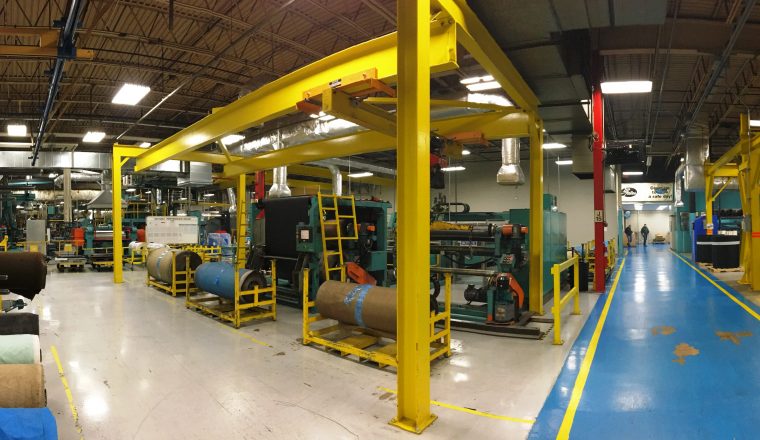 Large industrial room with crane support system.